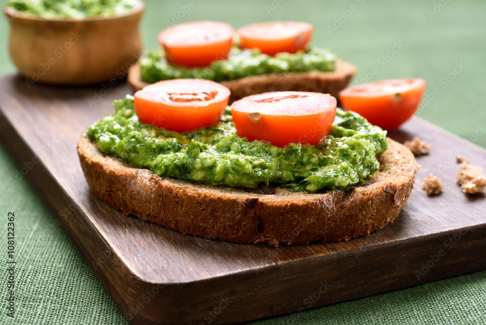 Sandwiches with pesto sauce and tomatoes
