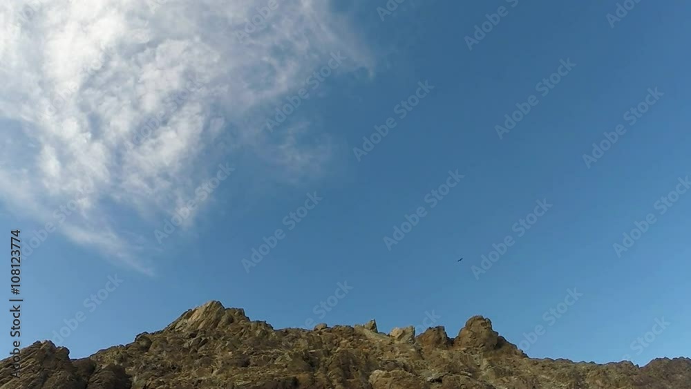 Scattering Clouds Floating Over Rocky Hillside in Mongolian Highland Scattering Clouds Floating Over Rocky Hillside in Mongolian Highland