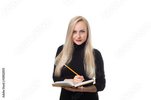 Business woman writing with pencil in notepad