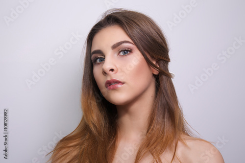 Fashionable portrait of a girl model. Fashion, glamour accessories, nude makeup. Freedom spring bright style lady, nude shoulders.