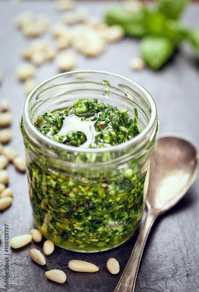 Fresh homemade Basil Pesto in glass jar Fresh homemade Basil Pesto in glass jar