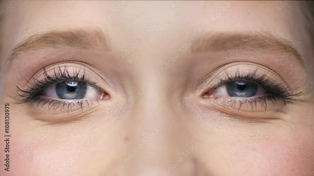 Macro of two beautiful eyes one is blinking
