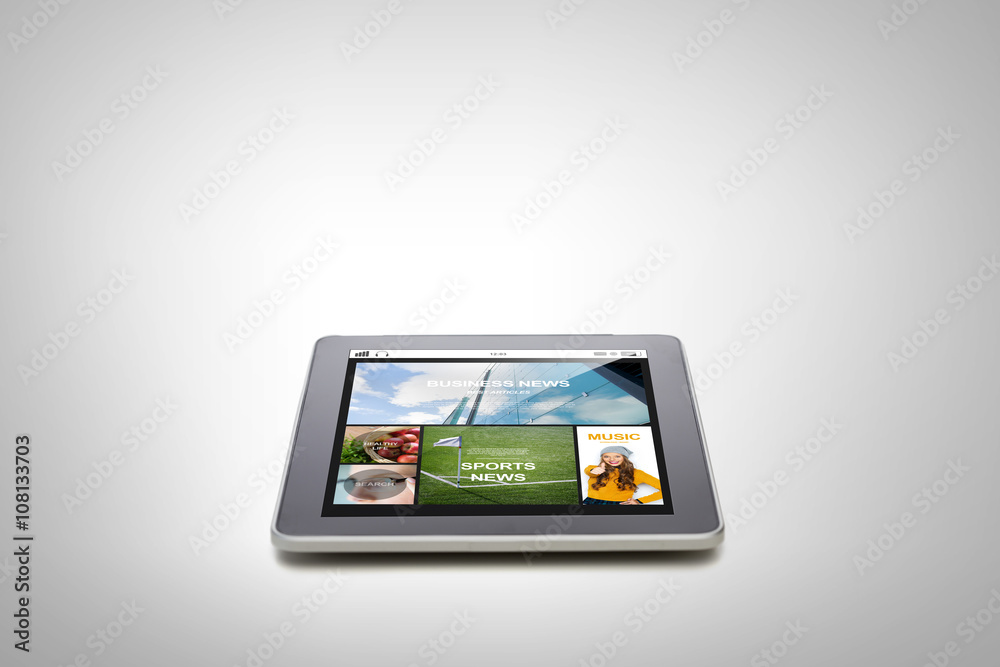 close up of tablet pc with news application close up of tablet pc with news application