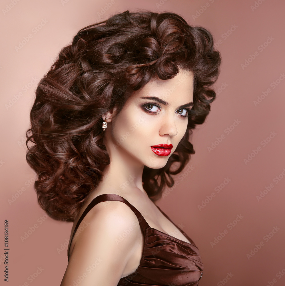 Hair. Makeup. Brunette woman with red lips and healthy curly hai Hair. Makeup. Brunette woman with red lips and healthy curly hai