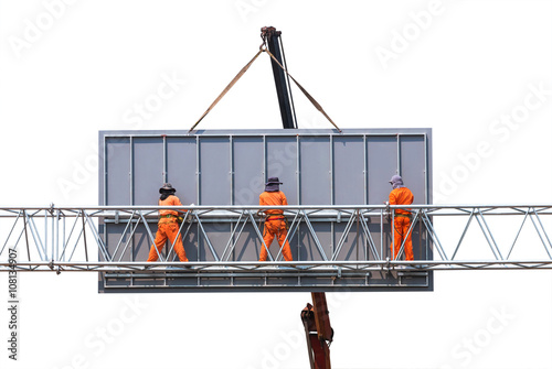 workers install big steel billboard on white  background photo