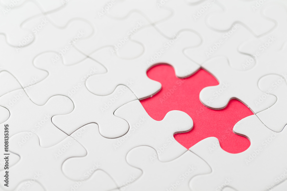 Puzzle with missing part on red background Puzzle with missing part on red background