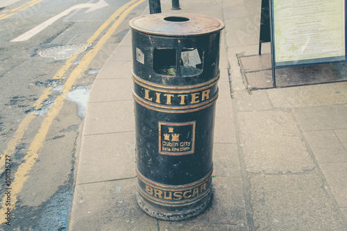 City bin of black color with golden edges and inscriptions.