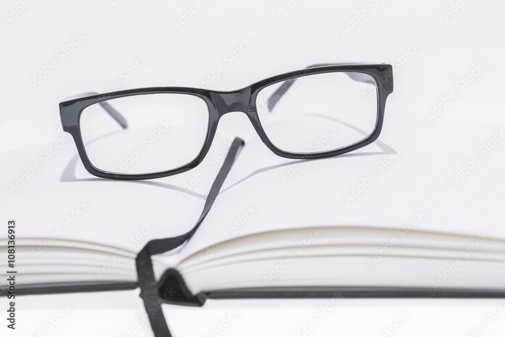 blank notice book with reading glasses blank notice book with reading glasses