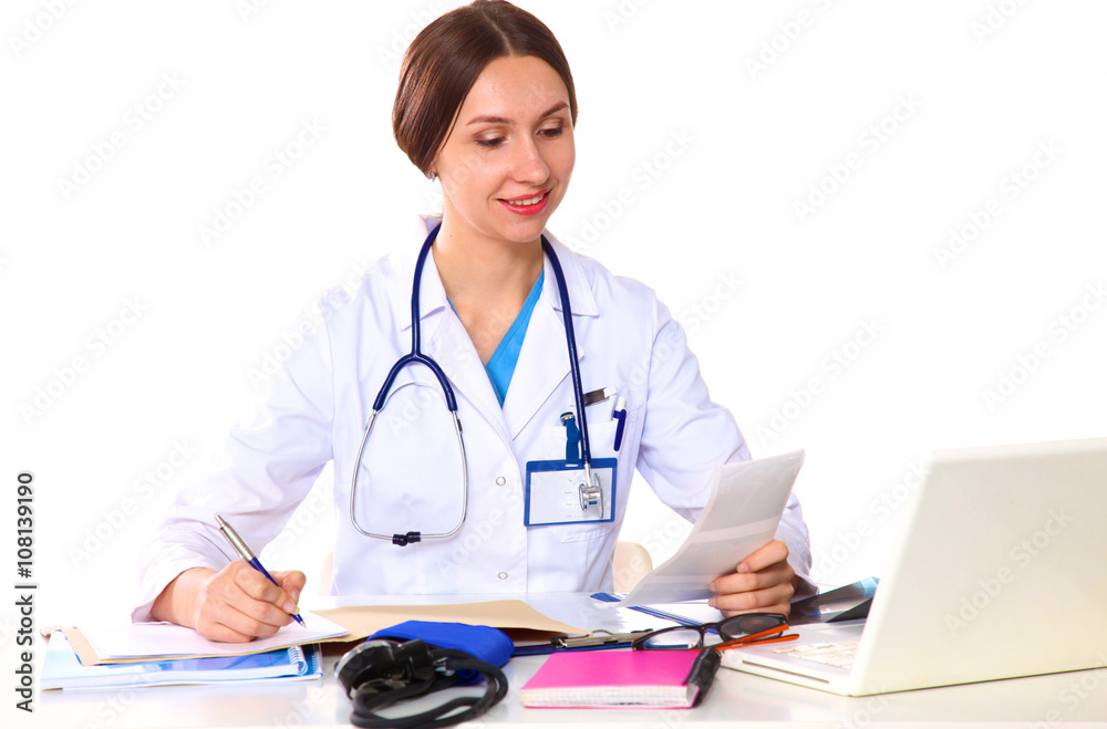Portrait of young female doctor sitting at desk in hospital Portrait of young female doctor sitting at desk in hospital