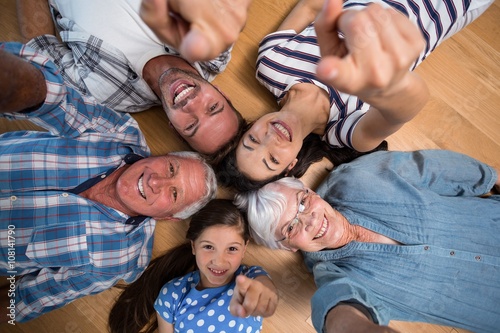 Happy family lying on floor