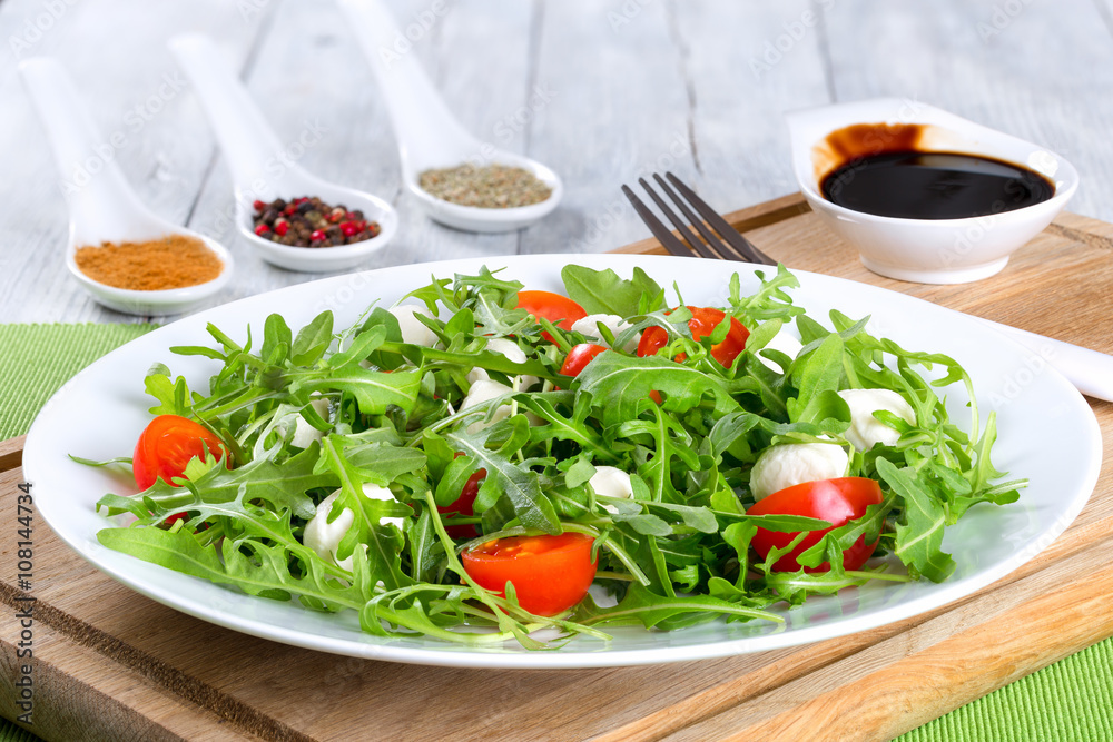 salad with tomatoes, mini mozzarella, arugula, close-up salad with tomatoes, mini mozzarella, arugula, close-up