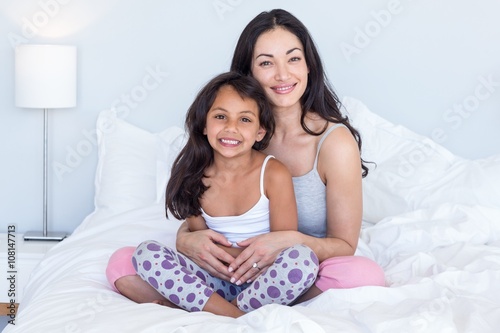 Woman relaxing with her daughter