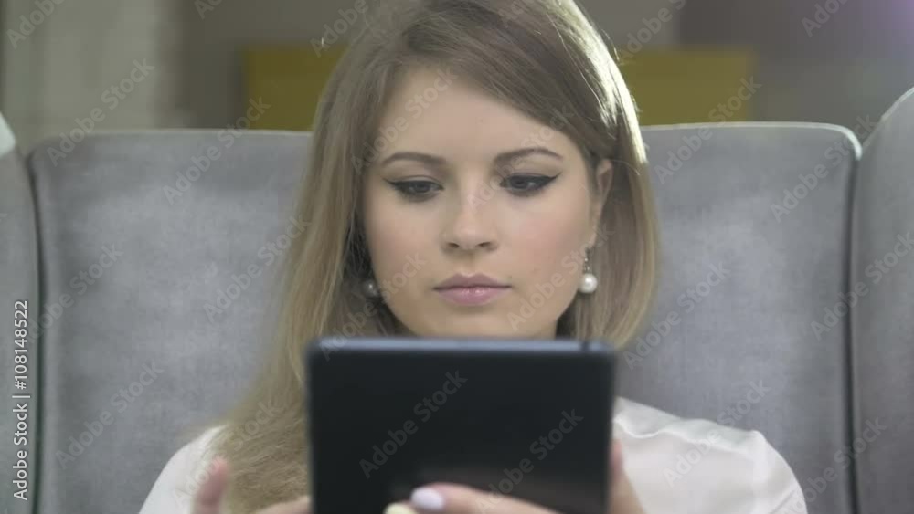 Portrait of Young Beautiful Smiling Woman Using Skype On Tablet PC Portrait of Young Beautiful Smiling Woman Using Skype On Tablet PC