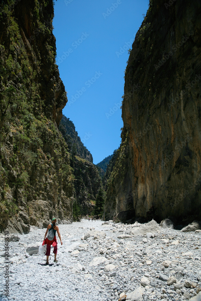 trekking woman walking in Samaria Gorge Crete