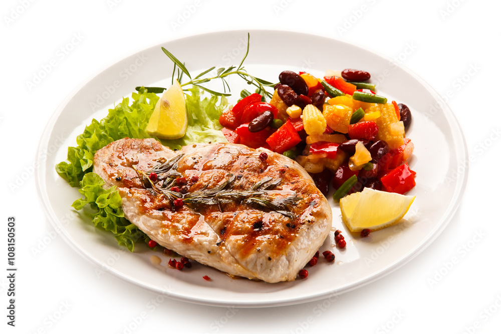 Grilled steak and vegetables on white background Grilled steak and vegetables on white background