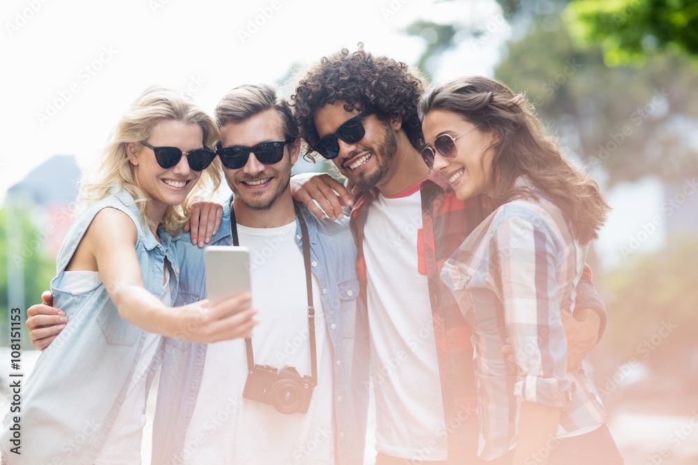 Friends taking selfie on a mobile phone Friends taking selfie on a mobile phone