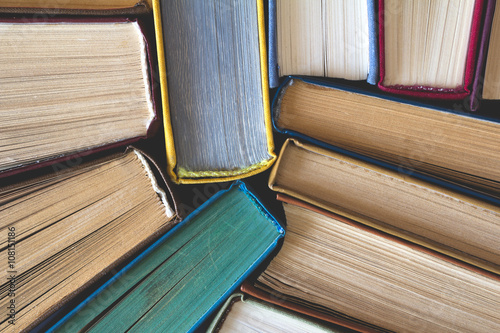 Stack of Used Old Books, top view photo