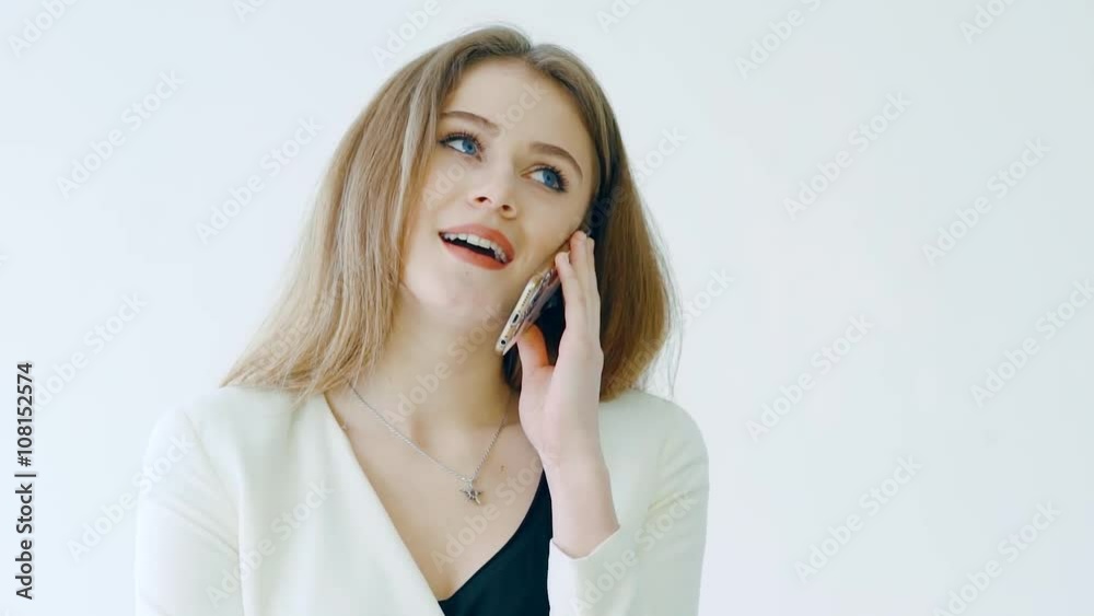 Cheerful woman talking on the phone isolated on a white background Cheerful woman talking on the phone isolated on a white background