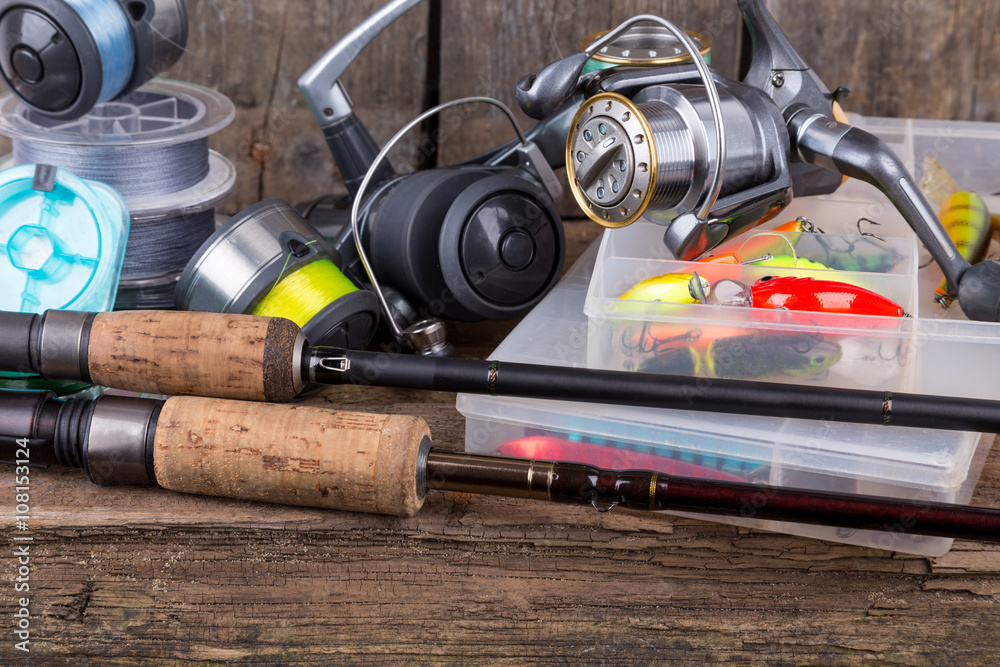 fishing tackles on vertical wooden board background fishing tackles on vertical wooden board background