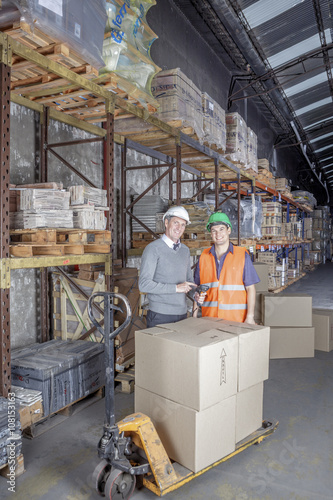 Workers In Warehouse Preparing Goods For shipping