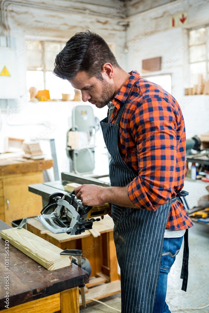 Carpenter working on his craft Carpenter working on his craft