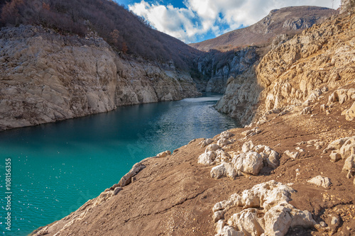 The Canyon of the lake and a blue sky with clouds