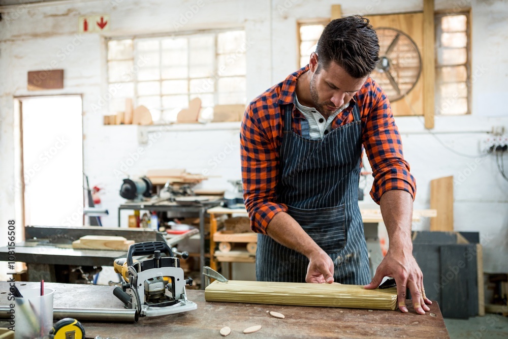 Carpenter working on his craft Carpenter working on his craft