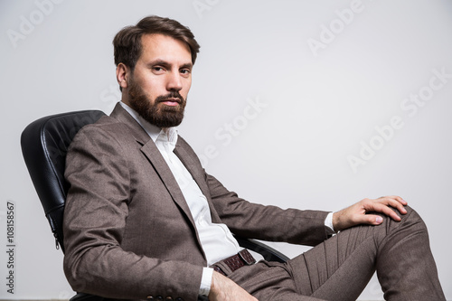 Bearded man on chair