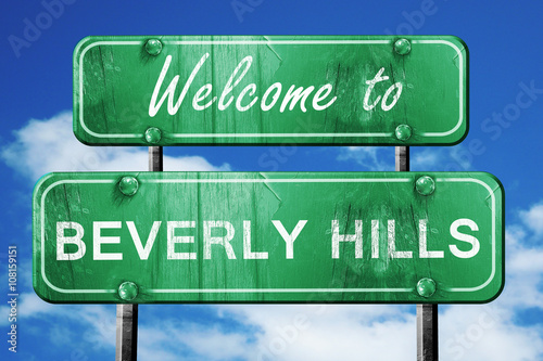 beverly hills vintage green road sign with blue sky background
