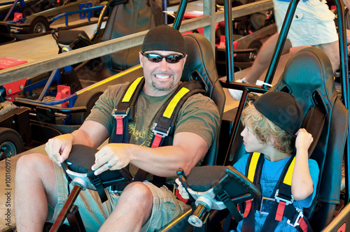 Εκτύπωση καμβά Handsome dad and son on go cart.