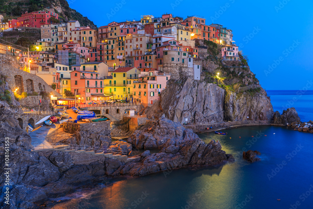 Sunset in Manarola.Manarola  is a small town, in the province of La Spezia, Liguria, northern Italy. It is the second smallest of the famous Cinque Terre towns frequented by tourists.