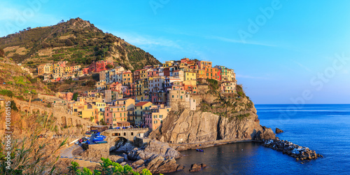 Fototapeta Naklejka Na Ścianę i Meble -  Sunset in Manarola.Manarola  is a small town, in the province of La Spezia, Liguria, northern Italy. It is the second smallest of the famous Cinque Terre towns frequented by tourists.
