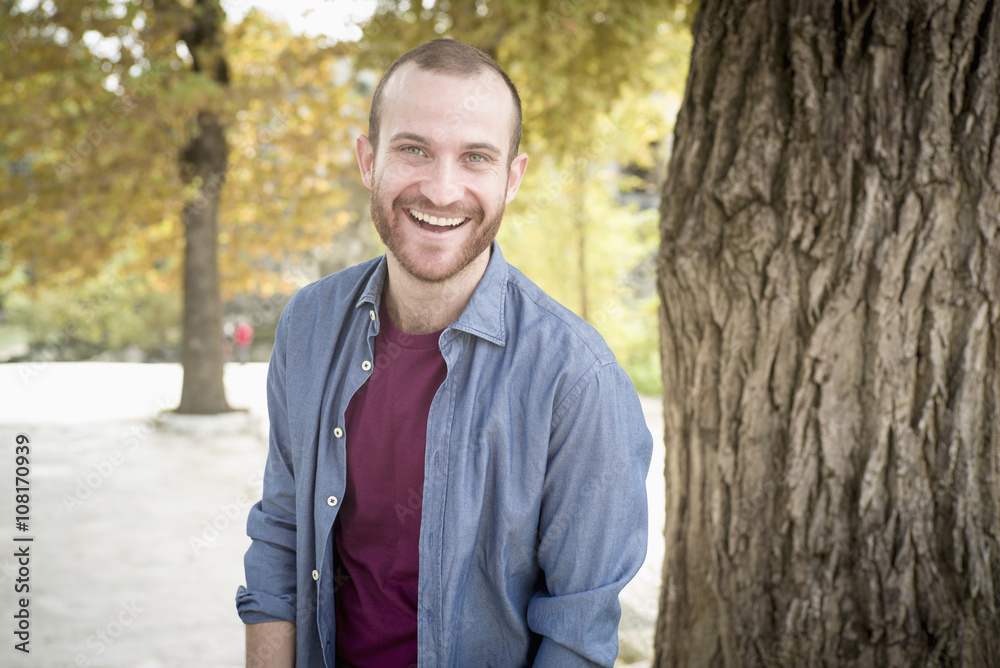 Caucasian man smiling in park