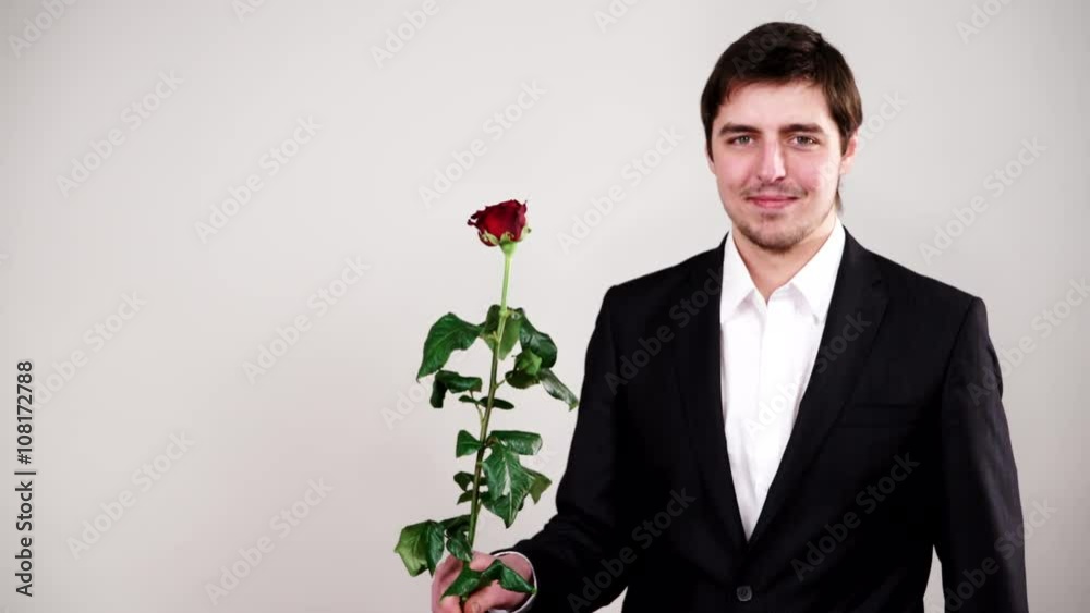 Man wearing suit holds red rose flower 4K Man wearing suit holds red rose flower 4K