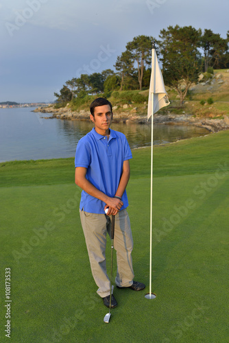 Young man playing golf