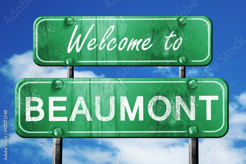 beaumont vintage green road sign with blue sky background photo