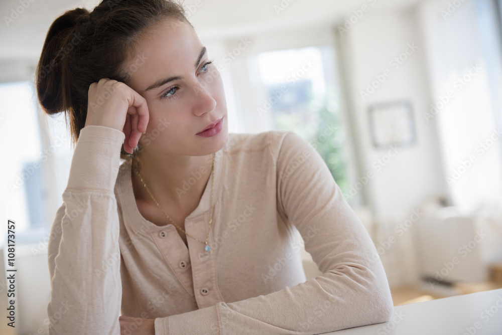 Sad Native American woman sitting at desk Sad Native American woman sitting at desk
