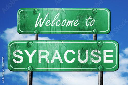 syracuse vintage green road sign with blue sky background photo