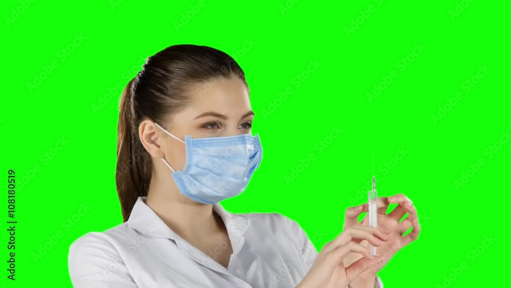 Doctor with injection. Green screen. Closeup Doctor with injection. Green screen. Closeup