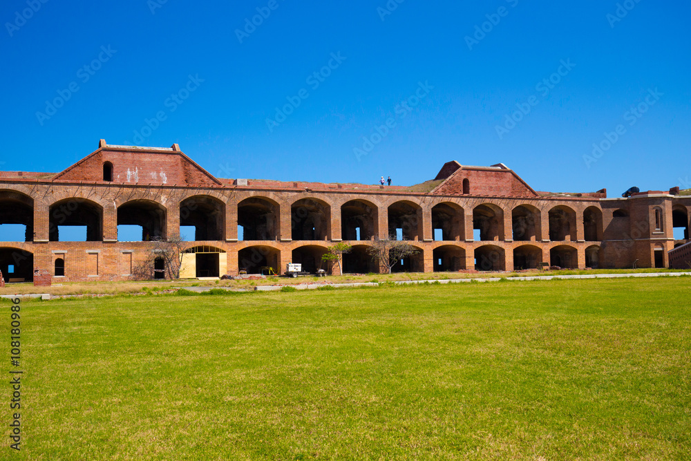 Standing on the moat which surrounds Fort Jefferson Civil War Fort and a prison for confederate soldiers