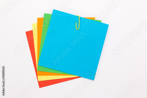 colored sheets with a yellow paper clip