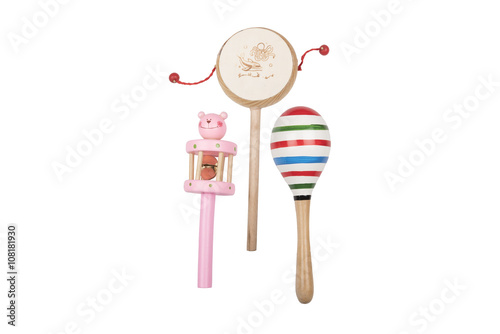 Wooden rattles and drum on a white studio background