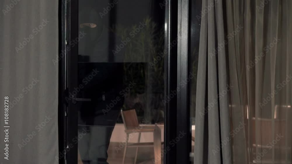 Thief with knife braking into home at night
Thief with knife braking into home at night