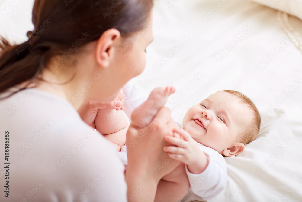 Mother and baby playing and laughing. A happy family Mother and baby playing and laughing. A happy family