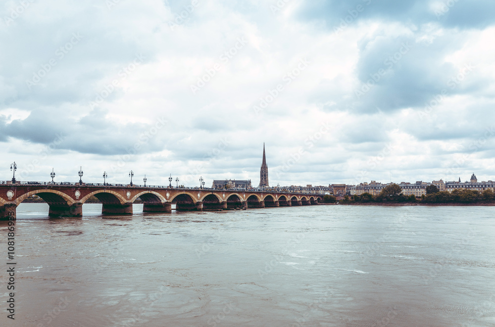 Fototapeta premium Bordeaux river bridge with St Michel cathedral, France