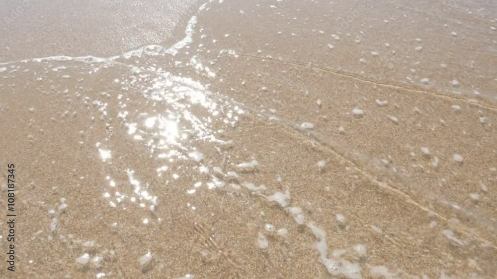 Slow motion sea water spreading on fine sand beautiful beach 1080p FullHD footage - Ocean sandy beach and waves slow-mo tilt 1920X1080 HD video Slow motion sea water spreading on fine sand beautiful beach 1080p FullHD footage - Ocean sandy beach and waves slow-mo tilt 1920X1080 HD video