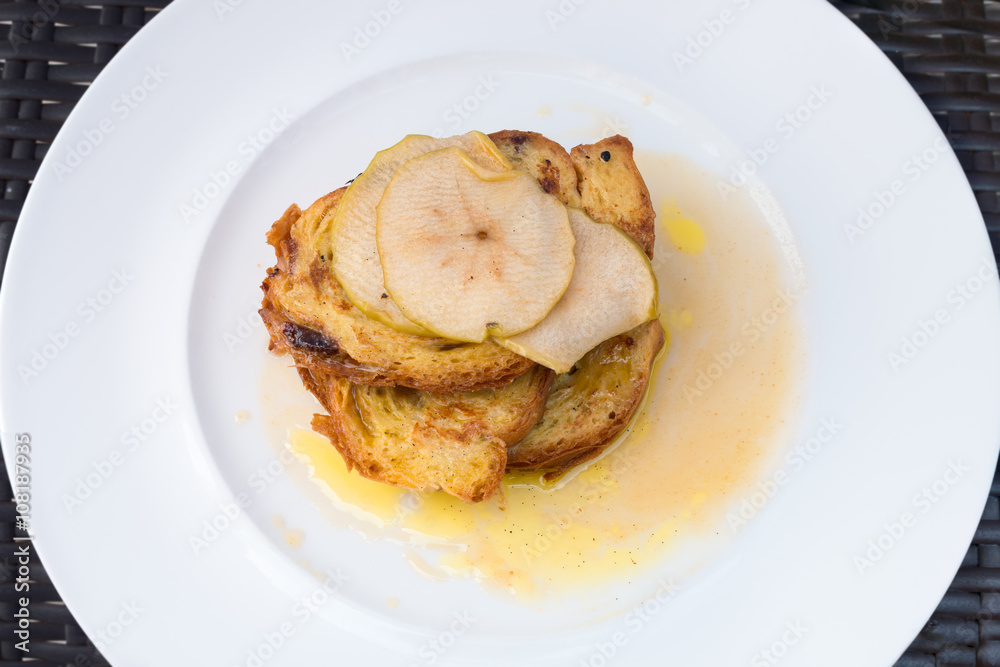 French raisin toast with buttered apples on top French raisin toast with buttered apples on top
