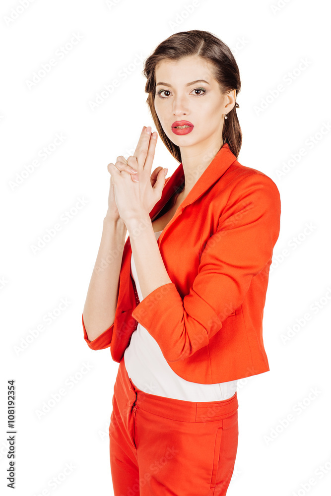 portrait of young business woman in red suit making gun gesture. isolated on white background. business and lifestyle concept portrait of young business woman in red suit making gun gesture. isolated on white background. business and lifestyle concept