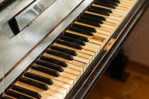 Old rusty piano keyboard, selective focus
