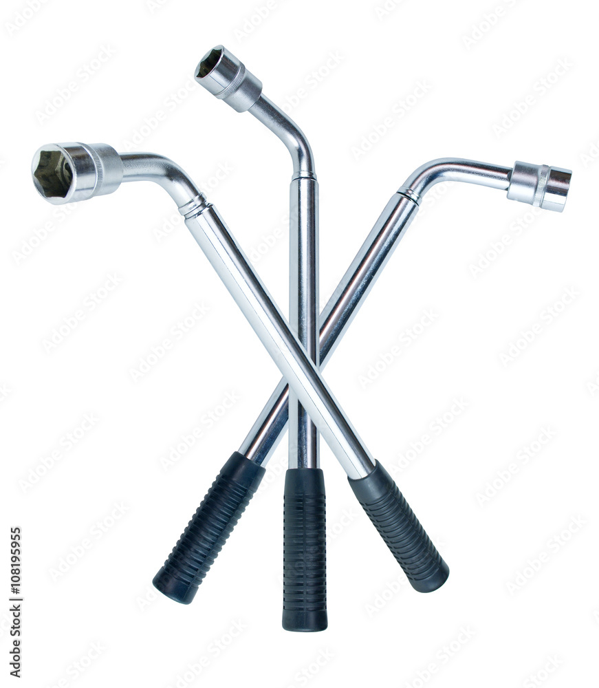 Wheel wrench with head isolated on white. Car accessory for changing a wheel on a car. Shiny metal. Wheel wrench with head isolated on white. Car accessory for changing a wheel on a car. Shiny metal.